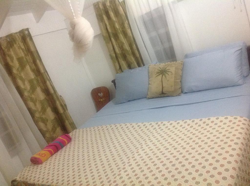 Rainbow Beach Apartments & Rooms Calibishie Oda fotoğraf